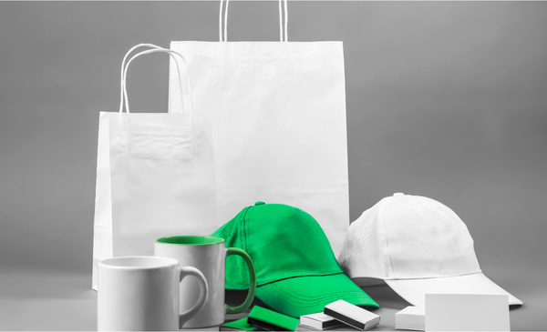 two-white-paper-bags-with-two-white-mugs-white-cao-green-cup-two-small-boxes-and two-white-boxes