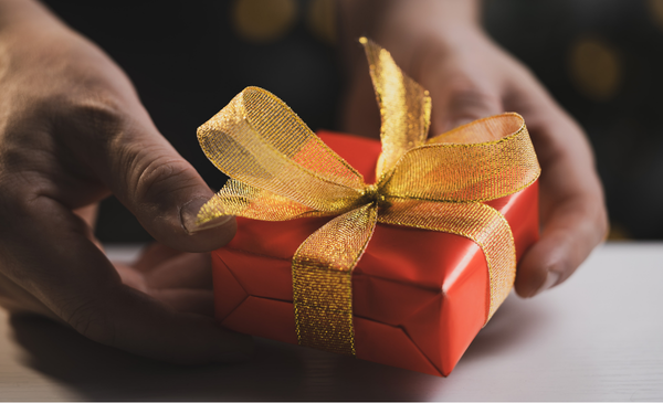 a-hand-holding-a-gift