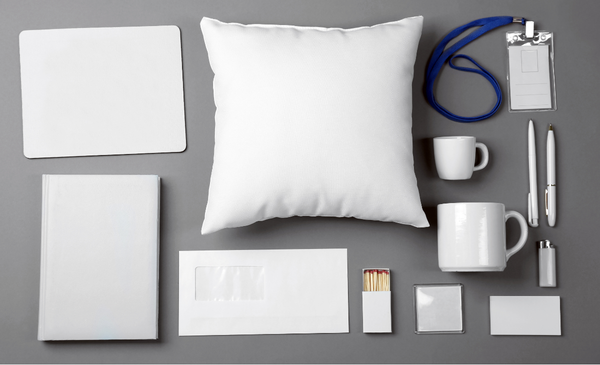 A-photo-of-white-items-consisting-of-mouse-pad-pillow-id-lace-notebook-envelope-match-box-mug-pens-and-card-case