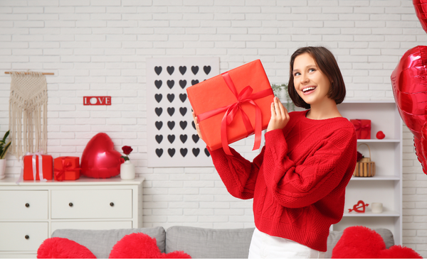 a-woman-holding-a-red-box