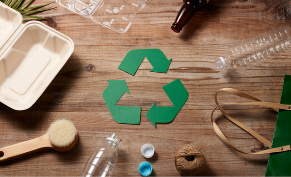 recycle-sign-surrounded-by-recycable-materials