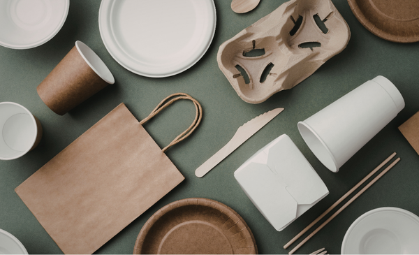 paper-bag-paper-cup-paper-plate-paper-utensils-placed-on-a-table