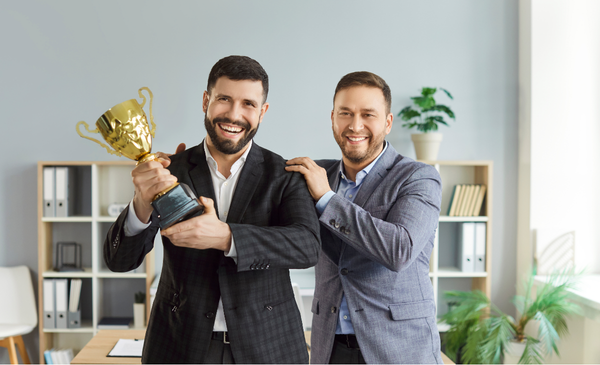 a-man-holding-an-award