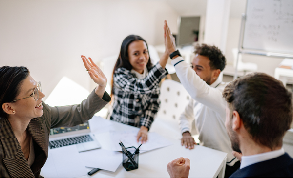 employees-celebrating-and-clapping-hands-with-each-other