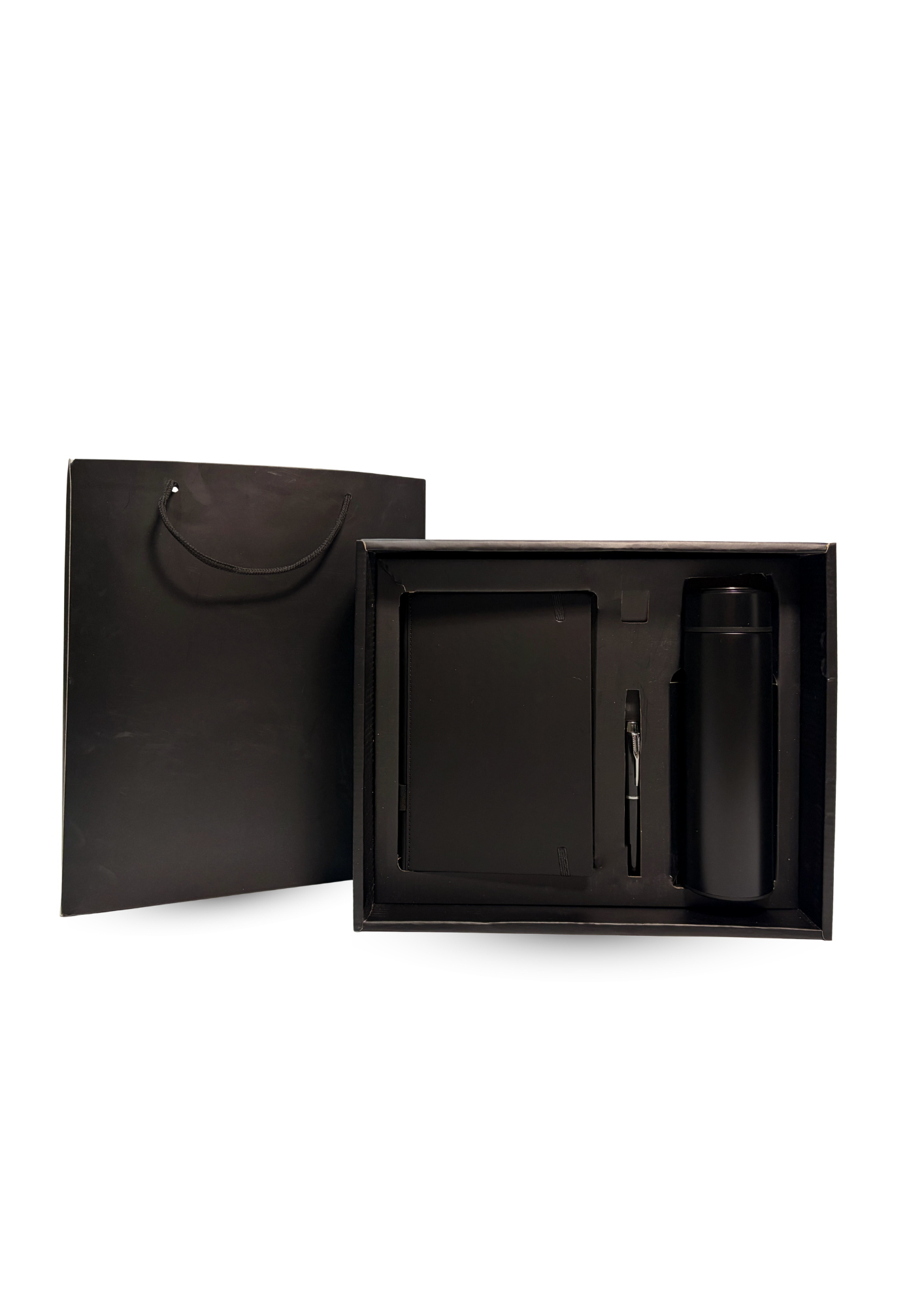 black-notebook-tumbler-and-pen-inside-a-box-and-with-a-paper-bag